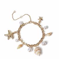 Freedom Gold Tone Pearl Shell and Metal Charm Bracelet