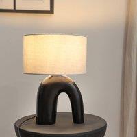 https://www.burton.co.uk/product/valuelights-lia-black-arch-abstract-ceramic-table-lamp-base_p-a6a01ee1-747b-4fbb-a6dd-a3f63cd64b80?colour=Black&size=One%20Size