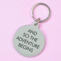 https://www.burton.co.uk/product/flamingo-candles-and-so-the-adventure-begins-keyring_p-737a53e8-afa1-464b-aa87-79bbe4a366f0?colour=Red&size=One%20Size