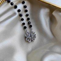 The Colourful Aura Women's Black Bead Four Heart Magnet Foldable Zircon Mangalsutra Necklace in Silver