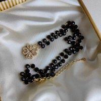 The Colourful Aura Women's Black Bead Four Heart Magnet Foldable Zircon Mangalsutra Necklace in Gold