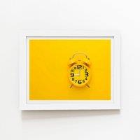 Warren Reed - Designer Yellow Alarm Clock Framed Art Print in White | Size: W16" x H24"