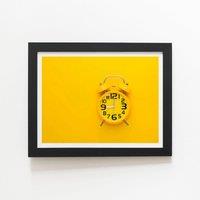 Warren Reed - Designer Yellow Alarm Clock Framed Art Print in Black | Size: W12" x H16"