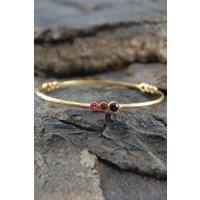 Otis Jaxon London Women's Triple Stone Garnet & Ruby Gold Birthstone Bangle