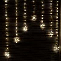 Samuel Alexander 1.2m Battery Operated Snowflake Christmas Curtain Lights with 147 Warm White LEDs in Beige