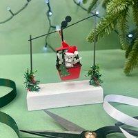 The Alphabet Gift Shop Cat In Cable Car Christmas Decoration in Red