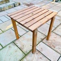 Charles Taylor Trading Solid Wood Bistro Table in Brown