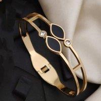 The Colourful Aura Women's Two Black Leaf Zircon Gold Lightweight Minimalist Stacking Bangle