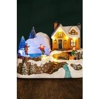 Marco Paul Winter village scene with ice rink | Size: 20 cm