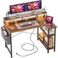 BEXEVUE L-Shaped Computer Gaming Desk with Power Outlets & Shelves 12070cm in Walnut | Size: 120 cm x 70 cm