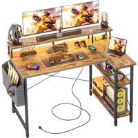 BEXEVUE L-Shaped Computer Gaming Desk with Power Outlets & Shelves 12070cm in Brown | Size: 120 cm x 70 cm