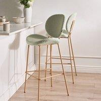 Wyld and Coco Two Light Green Boucle Bar Chairs with Wood-Look Iron Legs