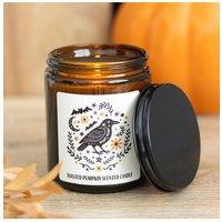 KDMD Frightful Folk Raven Toasted Pumpkin Scented Glass Candle in Brown
