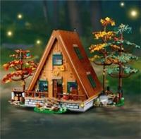 LEGO Ideas: A-Frame Cabin (21338) set with trees, 4 figures, and canoe