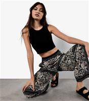 Women's Black Scarf Print Flared Trousers Apricot New Look