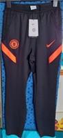Nike Chelsea FC Strike Junior Track Pants in Black / Orange, Children's Size L