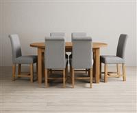 Extending Caversham Oak Oval Dining Table with 6 Brown Scroll Back Chairs