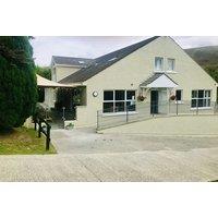 County Down Lodge Spa Break for 2 at East Coast Adventure: Hot Tub, Sauna, Prosecco, Chocolates & Pet Friendly Stay with Late Checkout